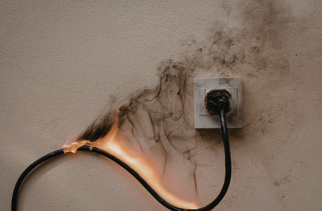 Electrical fire caused by overloaded plug socket in home
