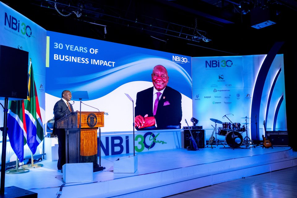 President Cyril Ramaphosa speaking at the National Business Initiative 30-year anniversary event in Johannesburg, highlighting business impact and inclusive economic growth.