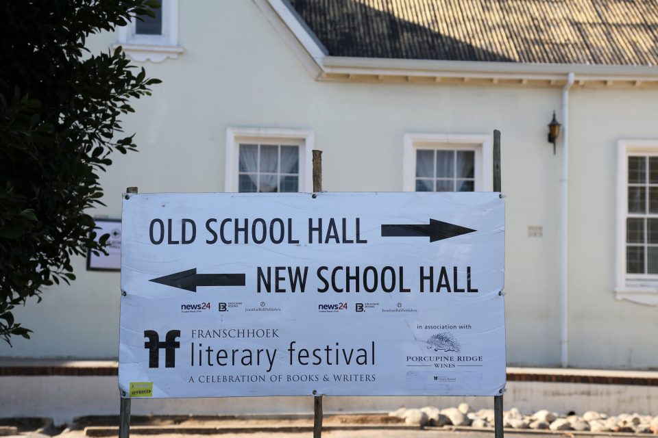 Signage directing visitors to venues at the Franschhoek Literary Festival celebrating books, authors and storytelling in South Africa.
