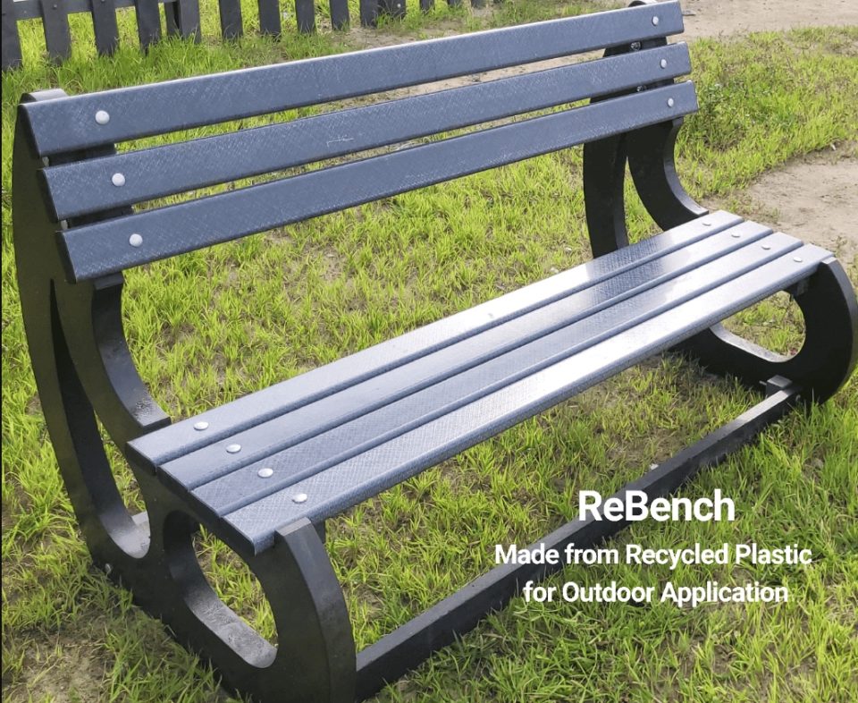 Outdoor bench made from recycled plastic designed for durability and sustainability in public spaces.