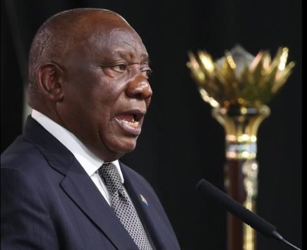 South Africans celebrating Freedom Day with national flags at a public event in Bloemfontein.
