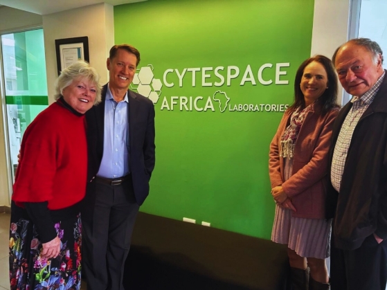 Cytespace Africa Laboratories team standing in front of branded office wall in South Africa
