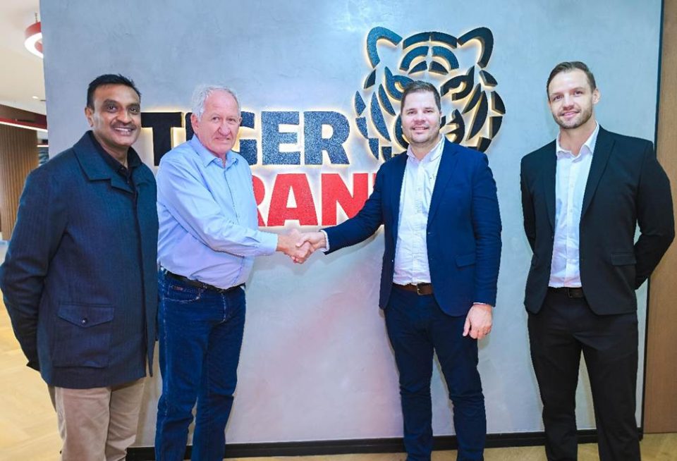 Executives from Tiger Brands and Apollo Africa during the signing of a renewable energy wheeling agreement focused on cleaner manufacturing operations.