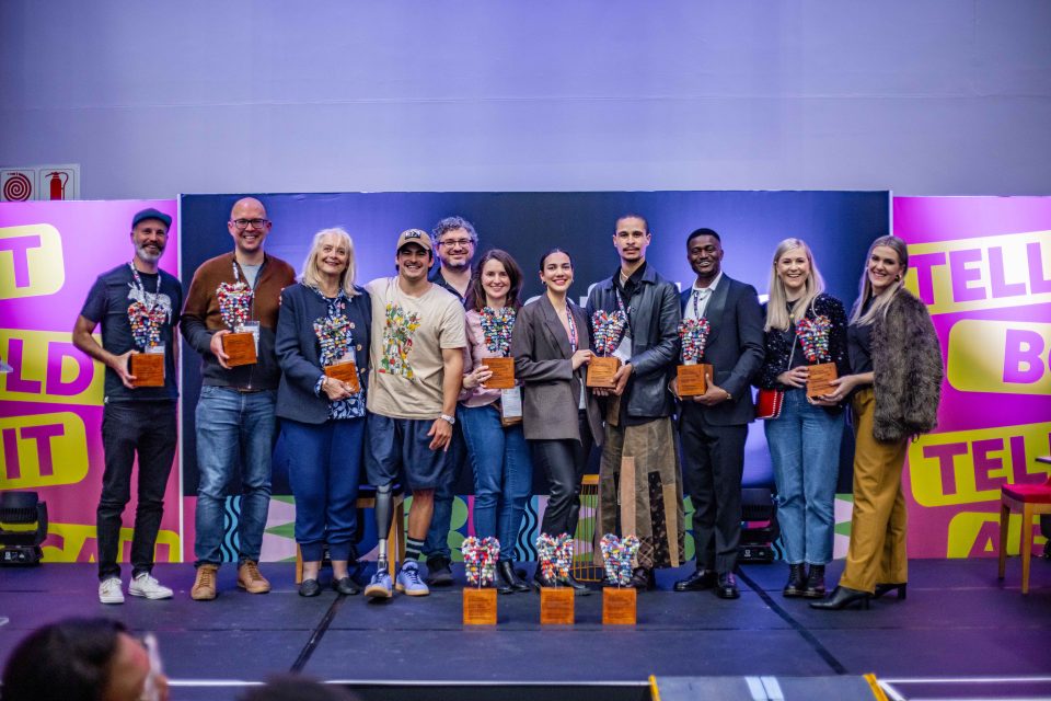 Winners and organisers pose on stage during the Inclusive Lens Awards ceremony celebrating diversity and inclusive storytelling in film and television.
