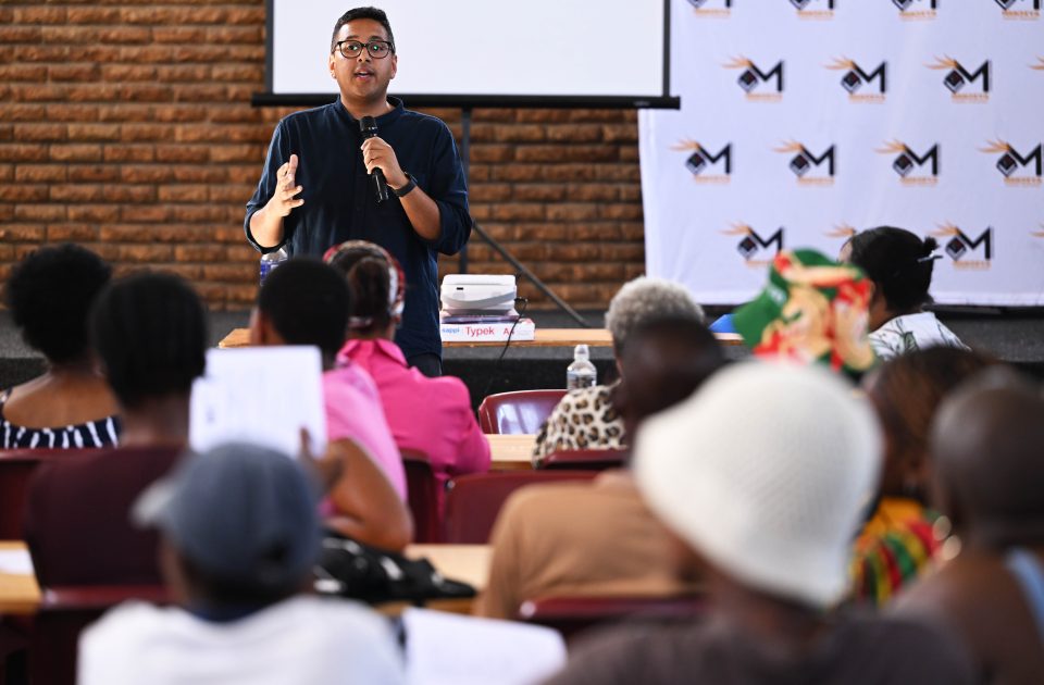 Community workshop facilitator speaks to residents during a water conservation and sanitation awareness session in Kraaifontein.