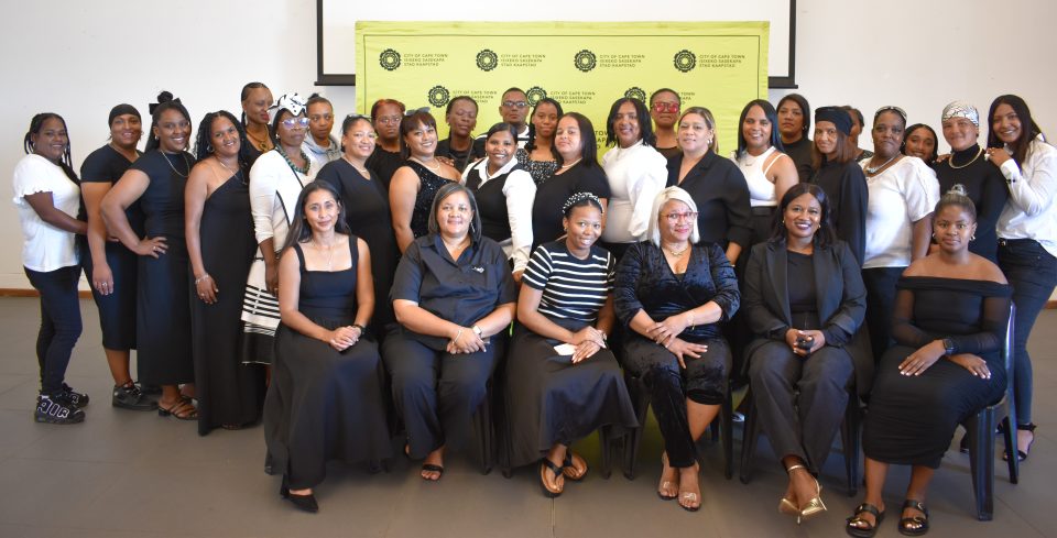 Group of women posing together at a City of Cape Town Women with Purpose programme graduation event focused on leadership and community empowerment.
