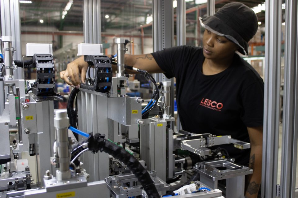 Lesco employee working on a semi-robotic production line at the company’s South African manufacturing facility.