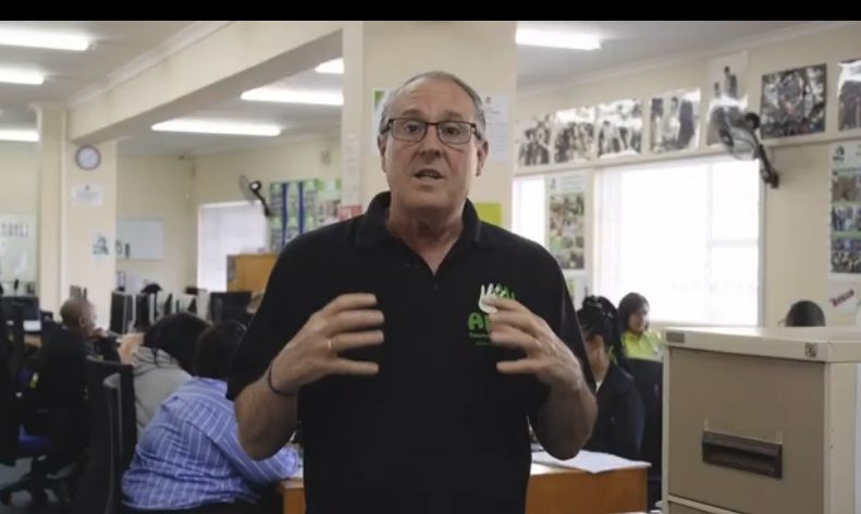 Amy Foundation representative speaks inside a youth development and learning centre featured on the BackaBuddy fundraising campaign page supporting marathon fundraising initiatives. Caption: