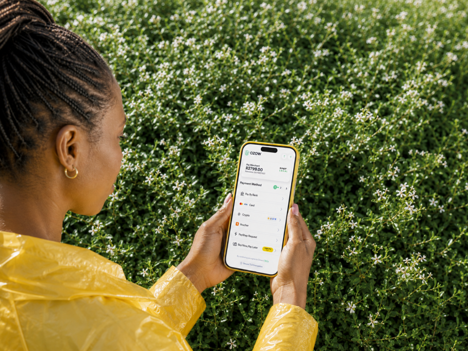 Person using a smartphone displaying Ozow and Buy Now Pay Later payment options on a mobile checkout interface.