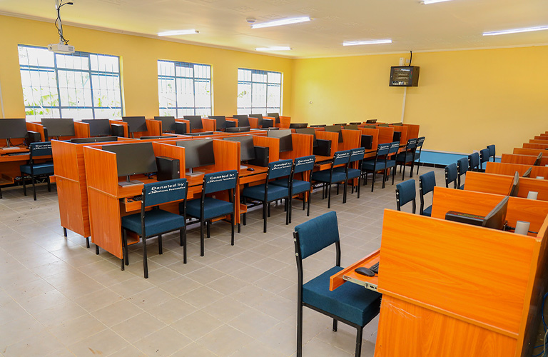 Modern computer laboratory equipped with desktop computers and workstations at Kisumu Boys’ High School in Kenya.