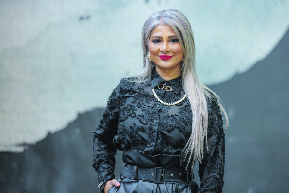 Katie Mohamed, CEO of BrandFusion, W-Suite and ChangeHub, poses for a professional portrait.
