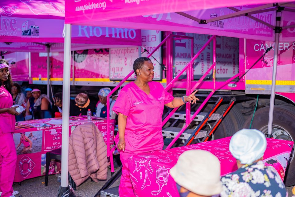 PinkDrive healthcare workers engage with community members during a breast cancer awareness and screening outreach programme, providing education, support and health services.