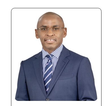 Portrait of Dr Peter Ndegwa, Group Chief Executive Officer of Safaricom, wearing a blue suit and striped tie.