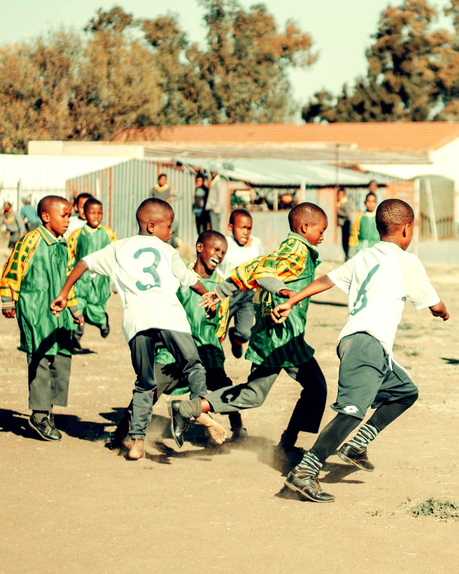 Children take part in a soccer-based Bond Through Play activity led by Sesame Workshop International South Africa, using play to support learning, teamwork and early childhood development.