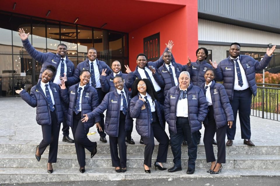 The University of the Western Cape Enactus team poses outside the 2026 Enactus South Africa National Competition venue in Johannesburg after showcasing its student entrepreneurship project.