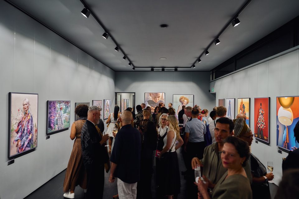 Visitors explore the Decisive Moment: Sony World Photography Awards exhibition at the Roger Ballen Centre for Photography in Johannesburg, featuring award-winning international photographs.
