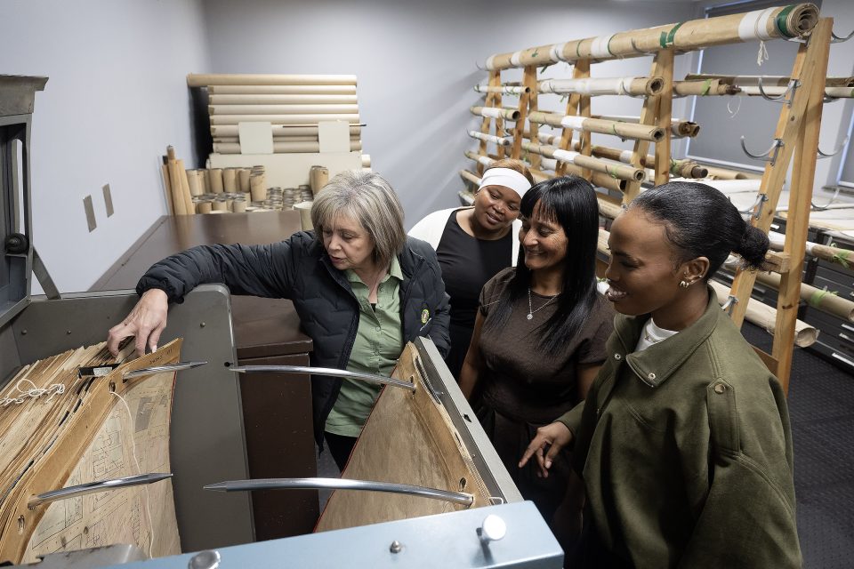 City of Cape Town staff and interns examine historical maps and archival records at the Environmental Heritage Resources Information Centre during the City's heritage digitisation programme.
