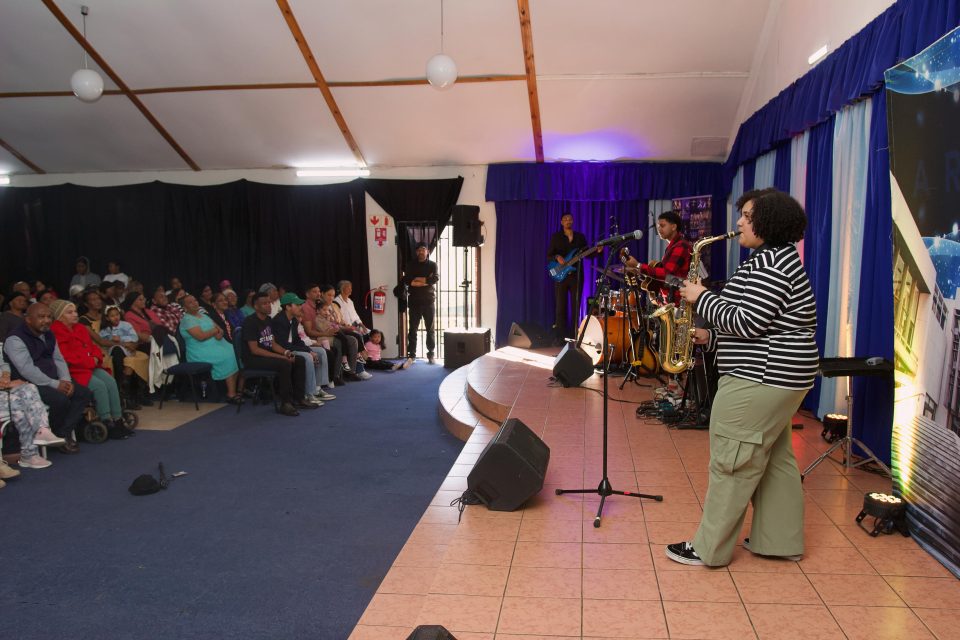 Local musicians perform during the Artscape Urban Outreach Concert at Hanover Park's First Community Resource Centre as residents gather to celebrate community talent.