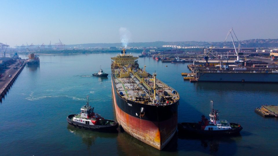 The crude oil tanker Troy is guided into Durban's Prince Edward Graving Dock by tugboats for major maintenance at the Port of Durban.