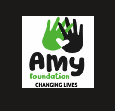 Amy Foundation logo featuring two joined hands in green and black with the words "Changing Lives."
