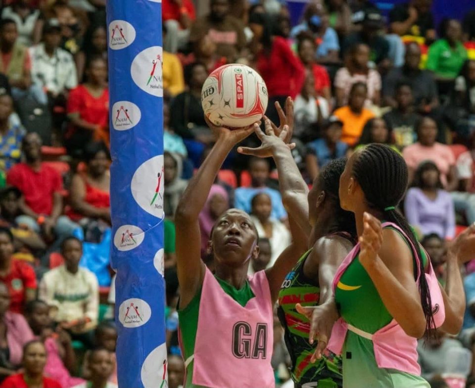 African women’s netball players compete near the goal during a continental netball match.
