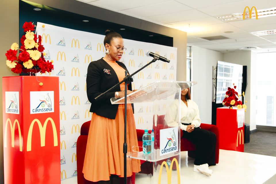Dr Mamello Masia addresses guests during the launch of the youth skills development partnership involving McDonald’s South Africa and CATHSSETA.