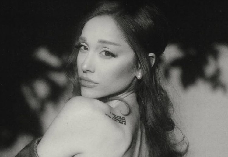 Ariana Grande pictured in a black-and-white portrait.