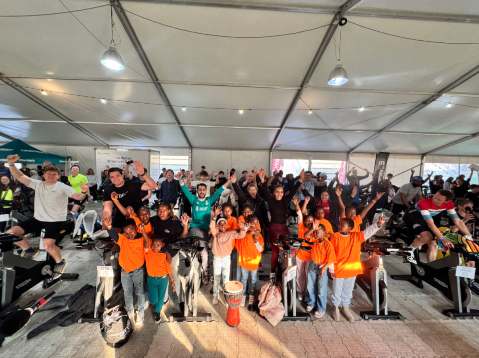 Children from VUSA Rugby and Learning Academy join cyclists during the 24-Hour Cycle Challenge supporting youth development programmes in Langa.