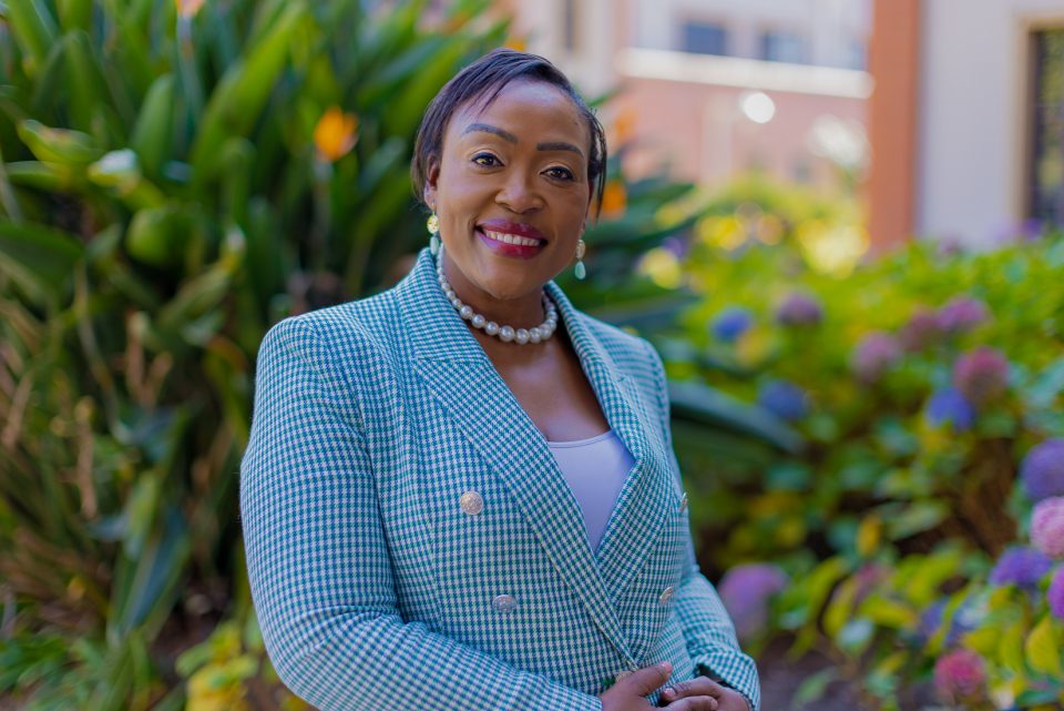 Sithembile Ndaba, Chief Marketing Officer of South African Tourism, pictured outdoors in a professional portrait.