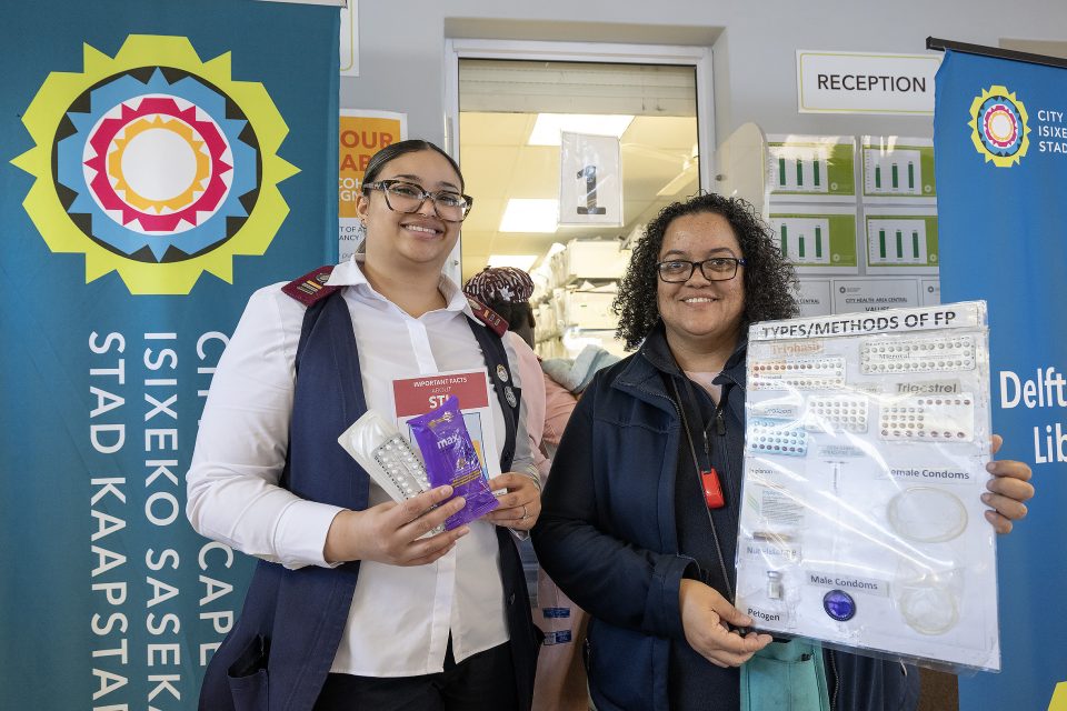 City Health nurses Justine Langenhoven and Sumaya Quickfall display contraceptive options and sexual health information at Delft South Clinic.