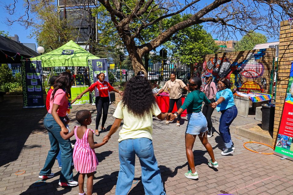 Boston Media House students and children from Hearts of Hope enjoy activities together during the Hearts2Hope Spring Day Play Date.