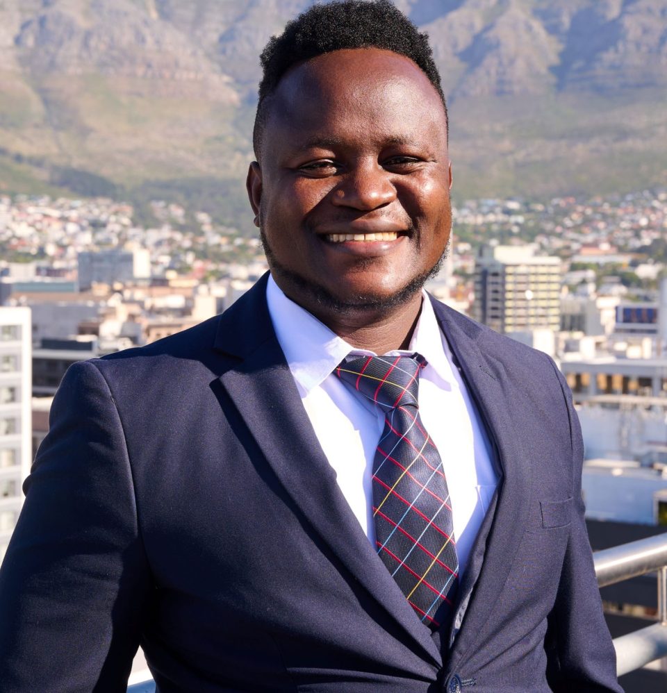 Odwour Midigo, winner of the 2026 Äänit Prize, photographed in Cape Town with Table Mountain in the background.