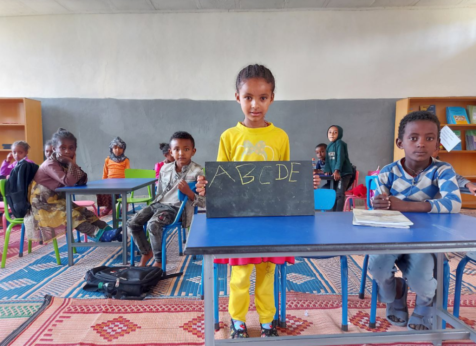 Children participate in a World Vision literacy programme designed to strengthen reading skills through community and classroom-based learning.