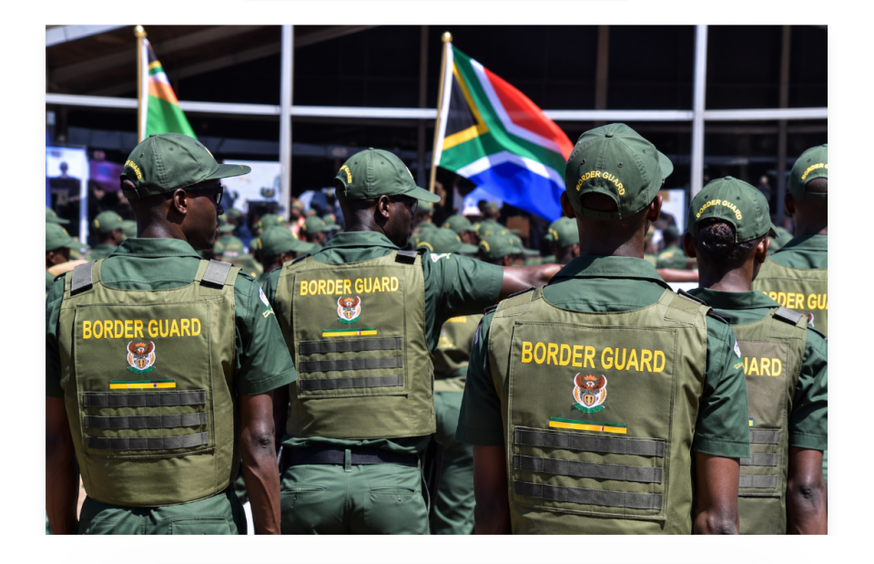 Border Management Authority officers gather beneath South African flags as the BMA advances digital border and port health services.