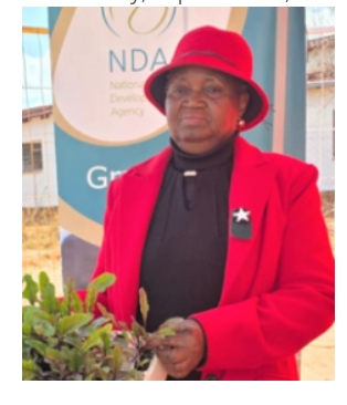 Maphosa Drop-in Centre founder Johanna Mailula with plants from the community’s growing agricultural initiative.