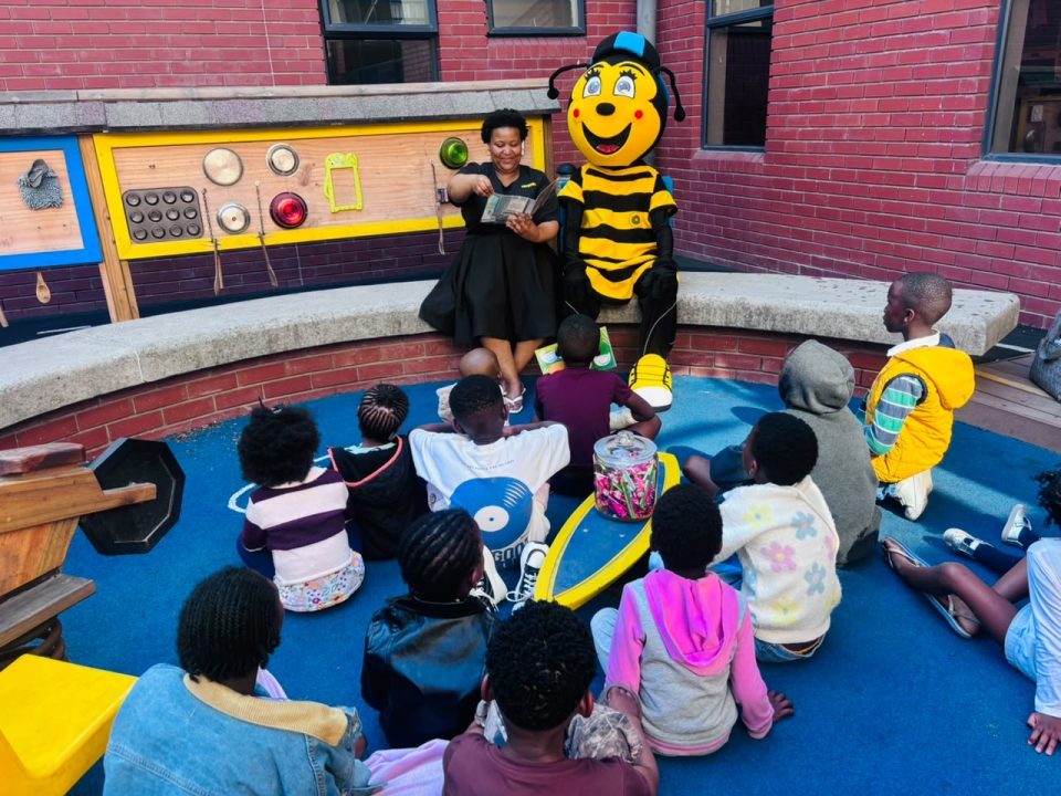 Storyteller Olwethu Mduma from Isivivana Library leads a storytelling session with children during a visit to the paediatric ward in Khayelitsha.