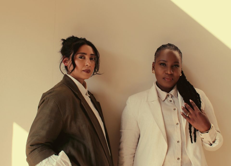 Two women entrepreneurs pose together in a professional portrait accompanying AMAZI Connect’s launch supporting health and beauty SMMEs.