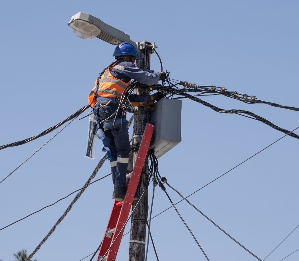 City of Cape Town electricity worker installing infrastructure as part of the Masonwabe electrification project in Gugulethu Title: Masonwabe Electrification Project