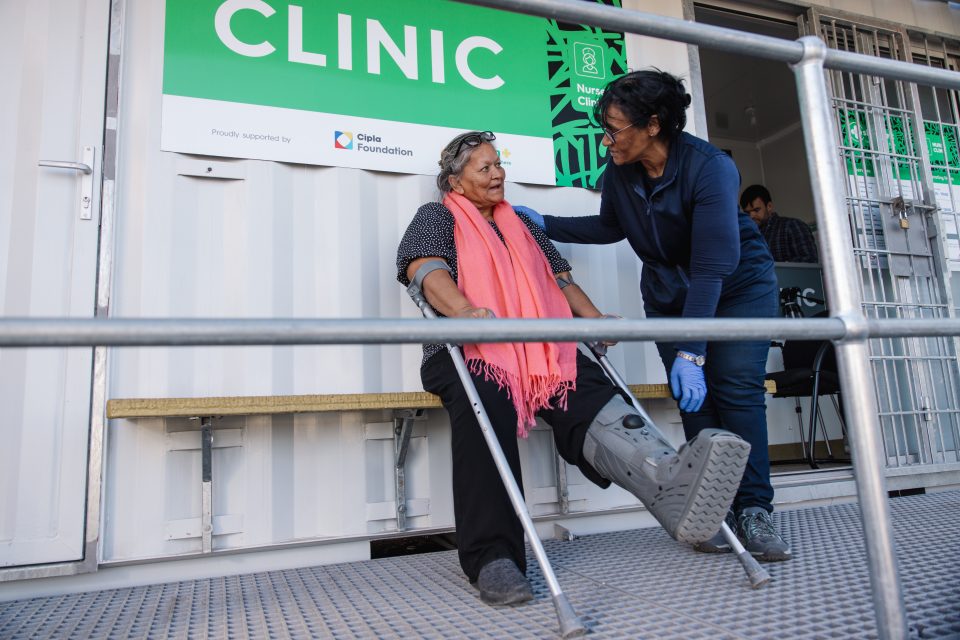 A nurse assists a patient outside the new Sha’p Left clinic in Macassar, supported by the Cipla Foundation and Dis-Chem.