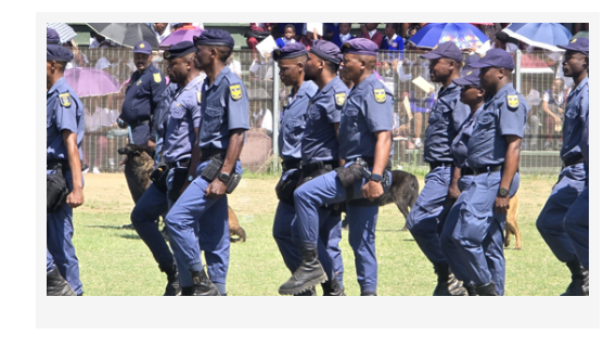 South African Police Service officers march in formation during an official policing event.
